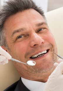 Man at the dentist having his teeth cleaned